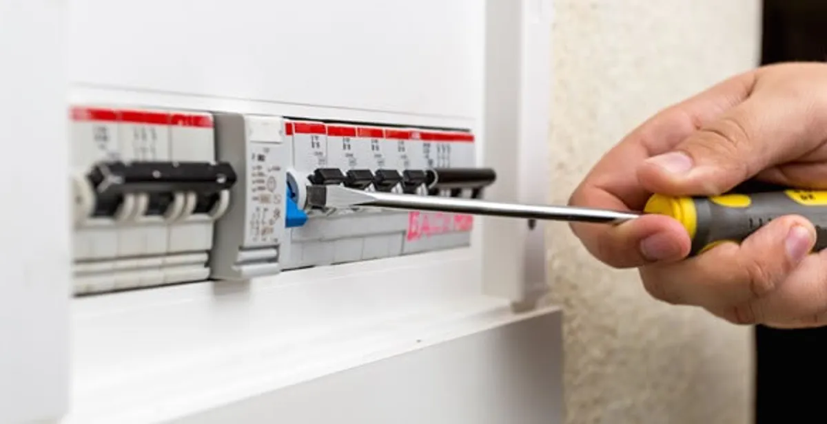 electrical panel upgrade service showing technician adjusting circuit breakers during system upgrade in Boca Raton, FL