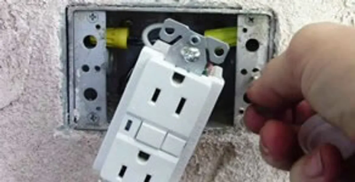 gfci circuits service showing installation of a ground fault circuit interrupter outlet by licensed electricians in Boca Raton, FL