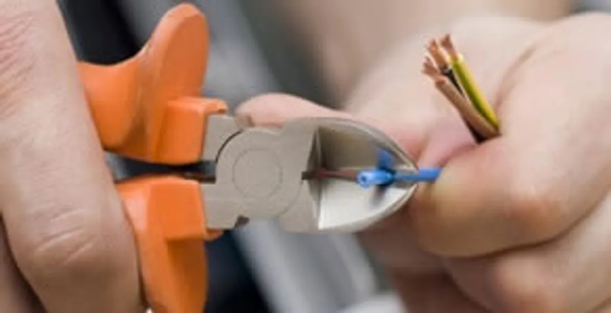 professional electrical services showing precise wire cutting by licensed electricians in Boca Raton, FL