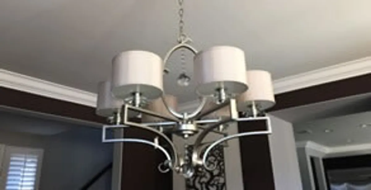 Modern chandelier installation with multiple light fixtures in Boca Raton, FL
